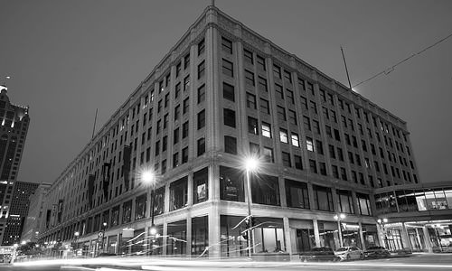 black and white photo of Lofts at Plankinton exterior at night